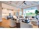 Open-concept living area with stylish furniture, kitchen, and seamless access to the outdoor space at 105 Godby Dr, Fayetteville, GA 30215