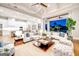 Open-concept living space boasts modern furniture and seamless indoor/outdoor transition at 105 Godby Dr, Fayetteville, GA 30215