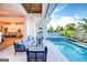 The backyard features a swimming pool, spa, outdoor kitchen, and plenty of space to relax and enjoy outdoor living at 105 Godby Dr, Fayetteville, GA 30215