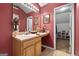 Bathroom with a vanity, mirror, and adjacent storage at 1028 Gloria Grand Blvd, Mcdonough, GA 30252