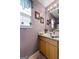 Bathroom featuring a vanity with cabinet storage and a decorative mirror at 1028 Gloria Grand Blvd, Mcdonough, GA 30252