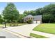 Charming two-story home with a long driveway, lush lawn and two car garage at 1028 Gloria Grand Blvd, Mcdonough, GA 30252