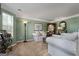 Cozy living room with neutral carpet, green walls, and comfortable seating at 1028 Gloria Grand Blvd, Mcdonough, GA 30252