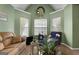 Cozy living room with floral accents, large window, and comfortable seating at 1028 Gloria Grand Blvd, Mcdonough, GA 30252