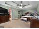 Main bedroom with a view to the ensuite and a comfortable furniture arrangement at 1028 Gloria Grand Blvd, Mcdonough, GA 30252