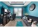 A brightly colored home office includes a desk, comfortable seating, and coordinated decor at 1028 Gloria Grand Blvd, Mcdonough, GA 30252