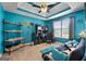 Bright blue home office featuring modern furniture, decorative wall art, and comfortable seating at 1028 Gloria Grand Blvd, Mcdonough, GA 30252