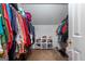 Walk-in closet with ample storage space and organized hanging racks at 1028 Gloria Grand Blvd, Mcdonough, GA 30252