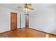 Bedroom with hardwood floors, a ceiling fan, a closet, and a connecting door at 1070 Elaine Dr, Forest Park, GA 30297