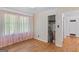 Charming bedroom with hardwood floors and natural light from large windows with pink curtains at 1070 Elaine Dr, Forest Park, GA 30297