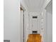 Hallway features hardwood floors, neutral walls, and doors to other rooms at 1070 Elaine Dr, Forest Park, GA 30297