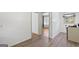 Bright kitchen features modern flooring, white cabinets, and natural light from the window at 1070 Elaine Dr, Forest Park, GA 30297