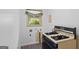 Compact kitchen area showcasing a gas range and a window above, for natural light at 1070 Elaine Dr, Forest Park, GA 30297