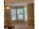 Bright and airy dining room featuring a bay window and neutral walls and carpet at 5327 Yoshino Ter, Powder Springs, GA 30127