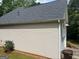 View of the side of the home, showing the siding and well maintained yard at 5327 Yoshino Ter, Powder Springs, GA 30127