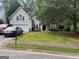 Charming two-story home with a well-manicured lawn, stone accents, and an attached two-car garage at 5327 Yoshino Ter, Powder Springs, GA 30127