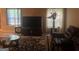 Comfortable living room with a large television, plush seating, and ample natural light from the windows at 5327 Yoshino Ter, Powder Springs, GA 30127