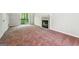 Comfortable living room area with a cozy fireplace and neutral carpeting at 4448 Janice Dr, Snellville, GA 30039