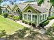 A birdseye view of the home featuring manicured landscaping and a cozy sunroom at 140 Rehobeth Way, Fayetteville, GA 30214