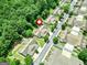 Overhead view of an attractive neighborhood with tree-lined streets and well-maintained homes and landscaping at 140 Rehobeth Way, Fayetteville, GA 30214
