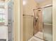 This bathroom features a tiled shower with glass doors and modern fixtures at 140 Rehobeth Way, Fayetteville, GA 30214