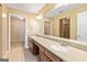 Bathroom featuring double vanity, large mirror, and tile flooring at 140 Rehobeth Way, Fayetteville, GA 30214