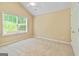 Bedroom with large window and neutral carpeting at 140 Rehobeth Way, Fayetteville, GA 30214