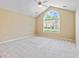 Bright bedroom with vaulted ceilings and large arch window at 140 Rehobeth Way, Fayetteville, GA 30214