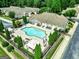 Beautiful community pool with lounge chairs, tables, and meticulous landscaping at 140 Rehobeth Way, Fayetteville, GA 30214