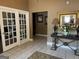 Inviting foyer with tiled floor, decorative console table, attractive lighting, and elegant accents at 140 Rehobeth Way, Fayetteville, GA 30214
