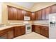 Bright kitchen showcases ample wood cabinetry, modern appliances, and seamless countertop space at 140 Rehobeth Way, Fayetteville, GA 30214