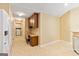 Compact kitchenette area, featuring desk, storage, and washer/dryer hookups at 140 Rehobeth Way, Fayetteville, GA 30214