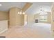 Open living space with fireplace and adjoining kitchen and dining areas at 140 Rehobeth Way, Fayetteville, GA 30214