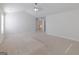 Spacious bedroom featuring carpet floors, ceiling fan, natural light, and closet at 236 Villa Grande Dr, Locust Grove, GA 30248