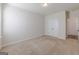 Neutral bedroom featuring carpeted floors, window for natural light and double door closet at 236 Villa Grande Dr, Locust Grove, GA 30248