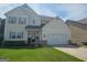 Charming two-story home features a two-car garage and a well-manicured lawn, offering excellent curb appeal at 236 Villa Grande Dr, Locust Grove, GA 30248