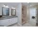 Bright bathroom with double vanity, granite countertop, and walk-in shower at 35 Deep Springs Way, Covington, GA 30016