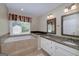 Bathroom features large tub and vanity at 35 Deep Springs Way, Covington, GA 30016