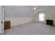 Spacious bedroom featuring neutral carpet, a ceiling fan, and natural light from a bright window at 35 Deep Springs Way, Covington, GA 30016