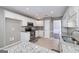 Well-lit kitchen features granite countertops, stainless steel appliances, and white cabinetry at 35 Deep Springs Way, Covington, GA 30016