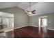 Open-concept living area with hardwood floors, neutral walls, and seamless flow to dining at 35 Deep Springs Way, Covington, GA 30016