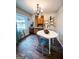 Dining area with a round white table, chairs, and a wooden hutch at 225 Second St, Bowdon, GA 30108
