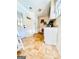 Utility room featuring white cabinetry, sink and washer/dryer hookups at 225 Second St, Bowdon, GA 30108