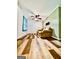 Well-lit living room with hardwood floors, cozy couch and natural light at 225 Second St, Bowdon, GA 30108