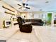Cozy living room showcasing a leather sofa and neutral wall colors at 225 Second St, Bowdon, GA 30108