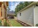 A well-maintained backyard with a play set and outbuilding on a grassy lawn at 527 Malcom Rd, Covington, GA 30014