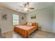 Bright bedroom with wood-look floors, a neutral color scheme, and natural light from the window at 527 Malcom Rd, Covington, GA 30014
