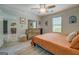 Cozy bedroom features neutral paint, light-filled windows, and a stylish wooden dresser at 527 Malcom Rd, Covington, GA 30014