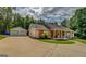 Charming single-story home with a large front yard and a detached two-car garage at 527 Malcom Rd, Covington, GA 30014
