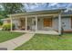 Inviting front porch with chairs, offering a welcoming entrance to the house at 527 Malcom Rd, Covington, GA 30014